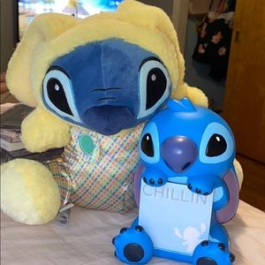 Two stitch collectibles. One plush one hard